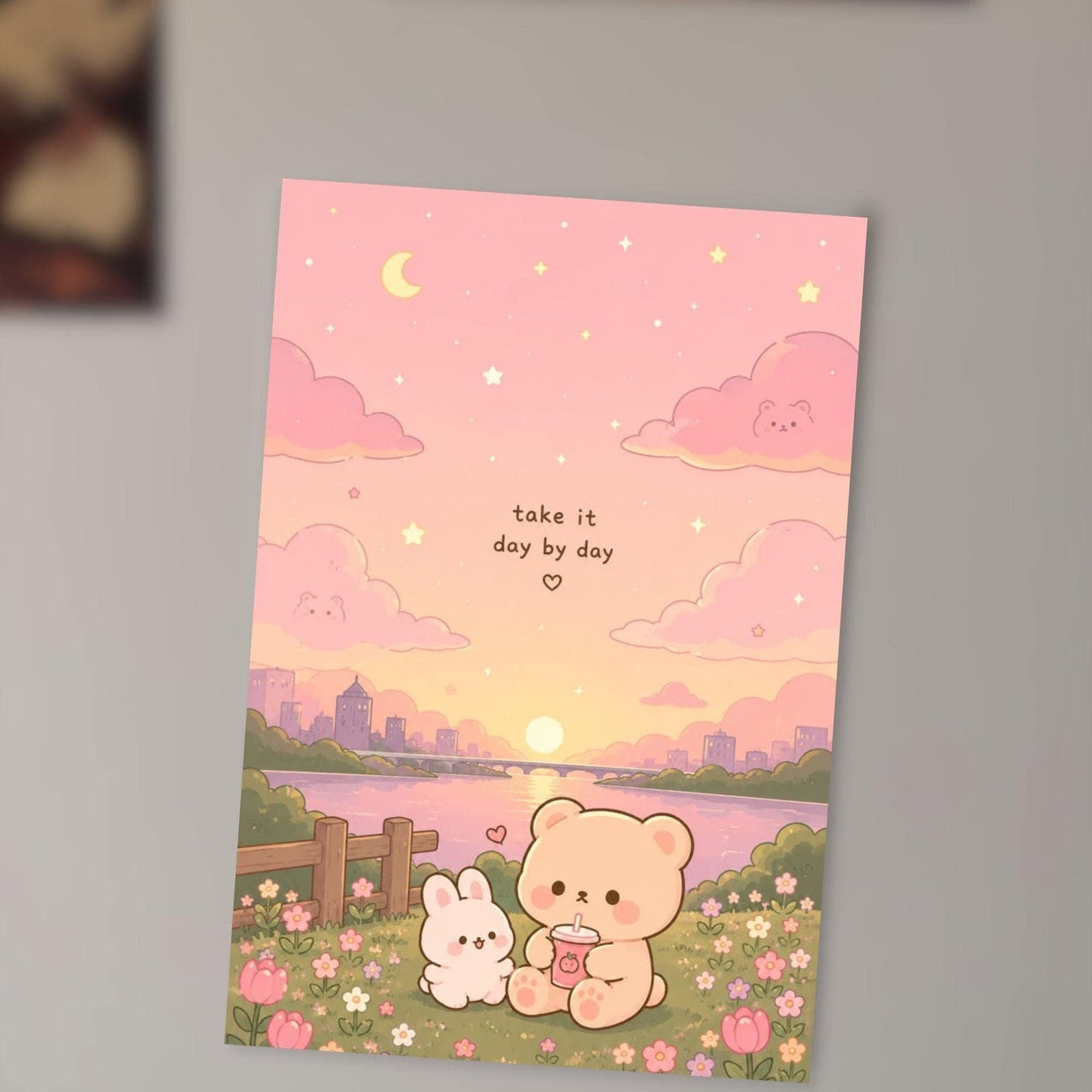 A colorful illustration depicting a serene scene with a pink sky, clouds, and a sunset, along with a small bunny and a bear sitting together in a field with flowers.