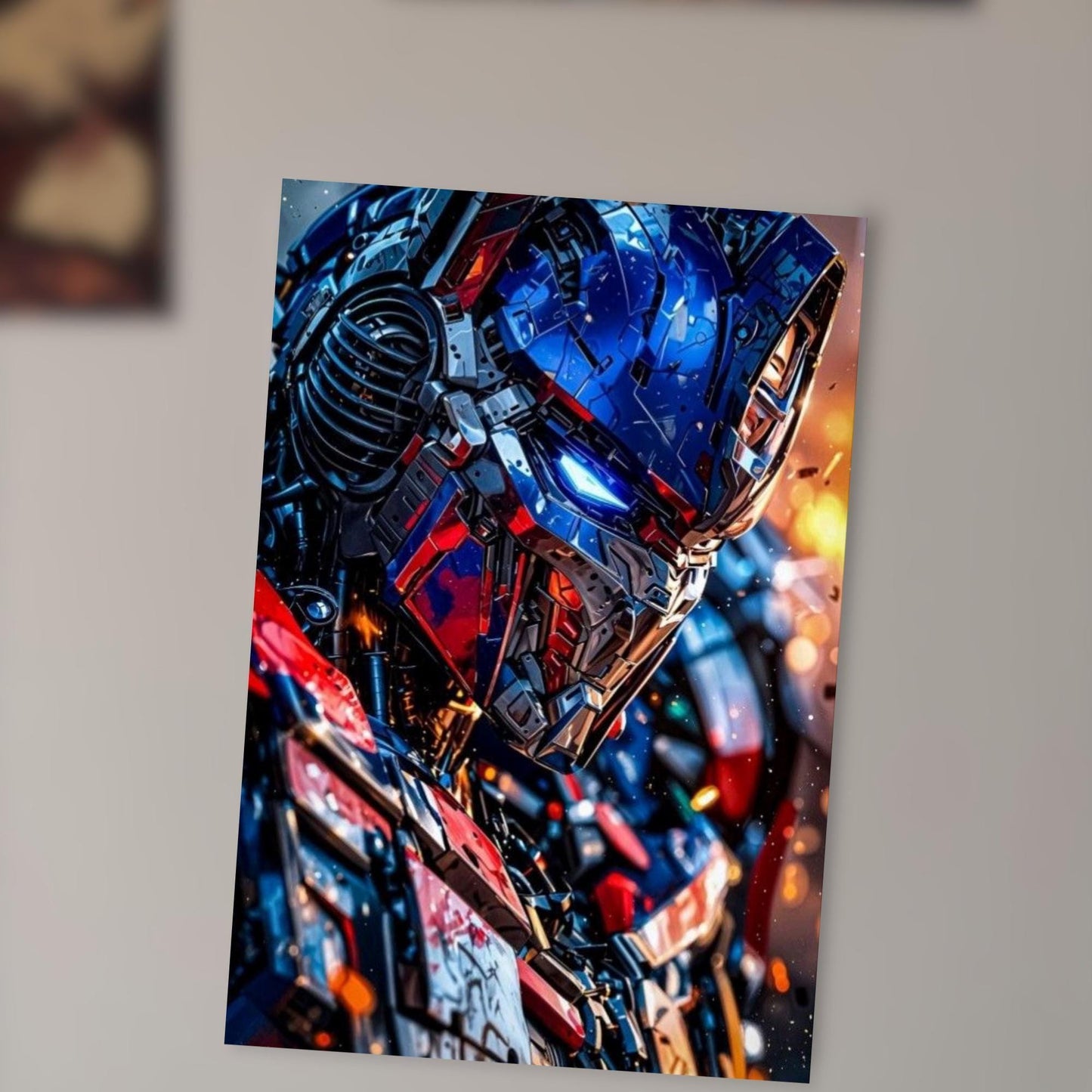 The image is a close-up of a robot or mechanical figure, with a striking combination of blue, red, and black colors. The robot appears to be in motion, with a dynamic and intense expression.