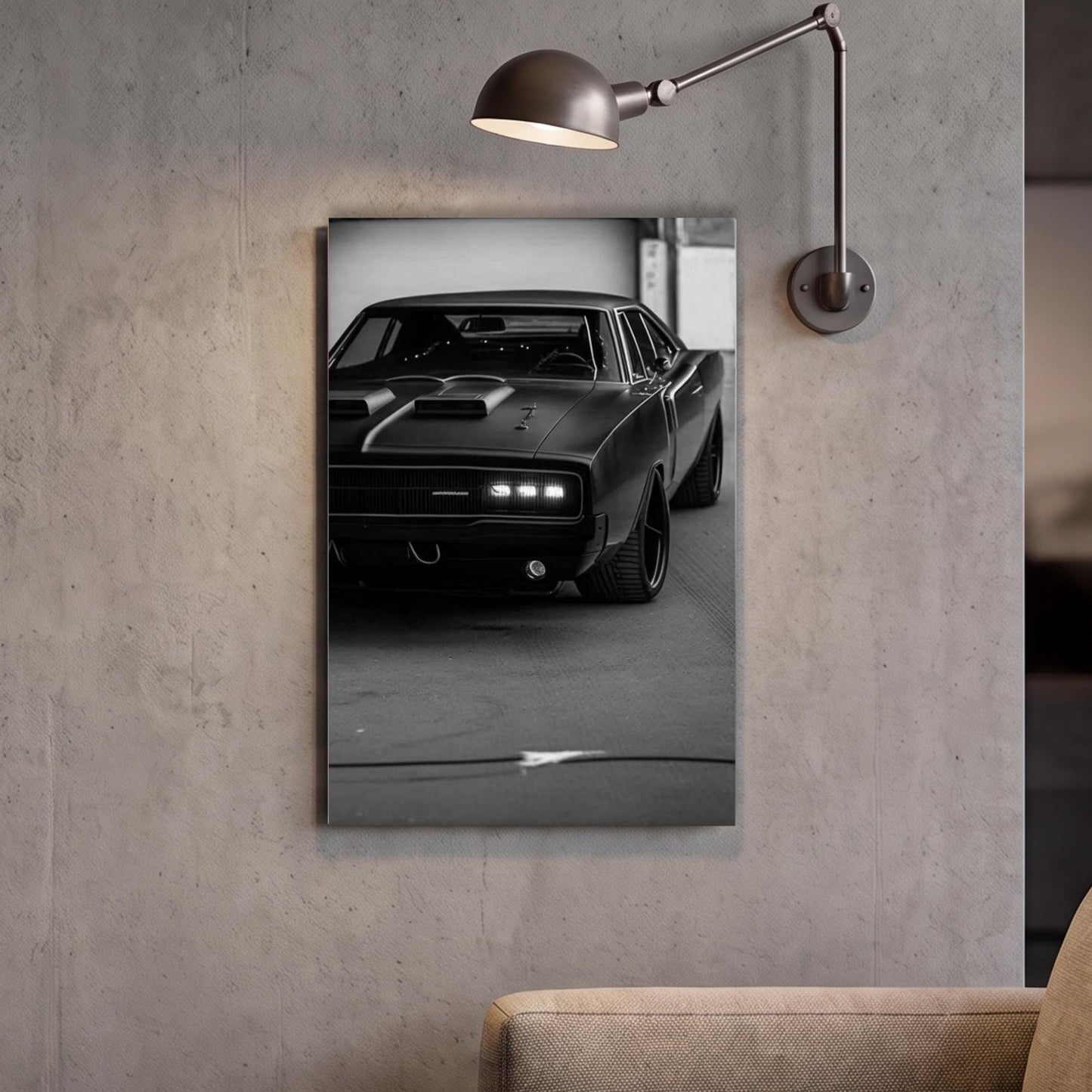 A black and white photograph of a classic muscle car is displayed on the wall, with a lamp fixture above it.